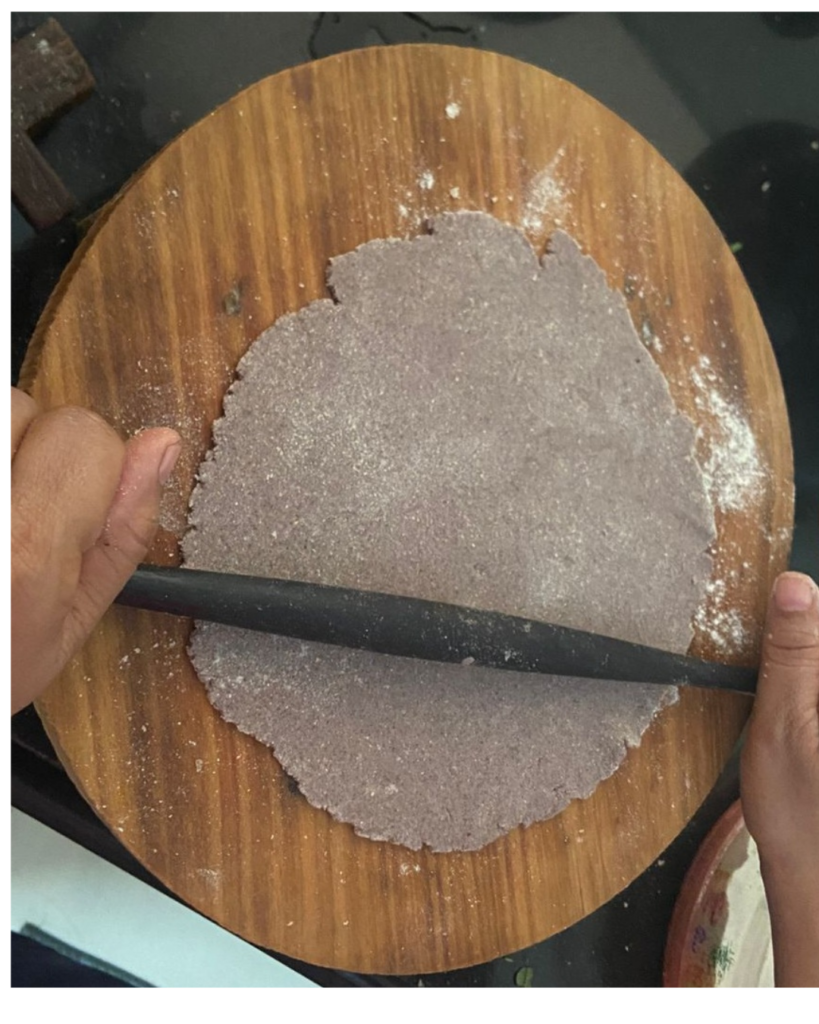 Ragi roti being rolled
